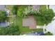 Aerial view of a property with a long driveway and a well-maintained lawn at 4757 Goldsboro Ct, Orlando, FL 32811