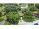 Aerial view of a beautiful property with lush landscaping and a long driveway at 4757 Goldsboro Ct, Orlando, FL 32811