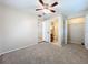 Bedroom featuring a view to an en-suite bathroom and a spacious closet at 4757 Goldsboro Ct, Orlando, FL 32811