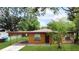 Charming single-story home with a covered carport and mature landscaping at 4757 Goldsboro Ct, Orlando, FL 32811