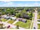 Charming single-story home features a well-manicured lawn and an attached garage, outlined for clear property lines at 500 E Gottsche Ave, Eustis, FL 32726