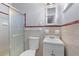 Cozy bathroom with shower, vanity and neutral tile at 500 E Gottsche Ave, Eustis, FL 32726