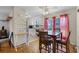 Eat-in kitchen features a dining table with seating and natural light at 500 E Gottsche Ave, Eustis, FL 32726
