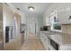 Functional kitchen features stainless steel appliances and granite countertops at 500 E Gottsche Ave, Eustis, FL 32726