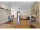 Open-concept living room with fireplace and view to dining area at 500 E Gottsche Ave, Eustis, FL 32726