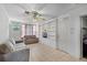 Bright living room with built-in shelving and tile flooring at 500 E Gottsche Ave, Eustis, FL 32726