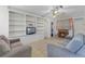 Open-concept living room featuring built-in shelving at 500 E Gottsche Ave, Eustis, FL 32726