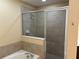 A bathroom with a bathtub and a shower at 5377 Via Appia Way, Sanford, FL 32771