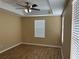 Empty bedroom with tray ceiling, blinds, and light-colored walls at 5377 Via Appia Way, Sanford, FL 32771