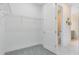 Walk-in closet with wire shelving and ample storage space at 6014 Tree Crossing Ln, St Cloud, FL 34771