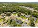 Aerial view of a neighborhood with mature trees and well maintained homes at 645 Macglenross Dr, Oviedo, FL 32765