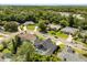 Aerial view of home surrounded by a lush green neighborhood with mature trees at 645 Macglenross Dr, Oviedo, FL 32765
