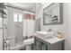 Bathroom with gray vanity, vessel sink, modern tile, and glass shower doors at 645 Macglenross Dr, Oviedo, FL 32765