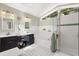 Bathroom showcasing double sink vanity, soaking tub, separate glass shower and natural light at 645 Macglenross Dr, Oviedo, FL 32765