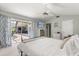 Bedroom with sliding glass door leading to the outdoor living area and pool at 645 Macglenross Dr, Oviedo, FL 32765
