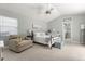 Vaulted ceiling bedroom with bright natural light, carpet flooring, ceiling fan and neutral paint at 645 Macglenross Dr, Oviedo, FL 32765