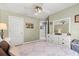 Bedroom featuring neutral paint, ceiling fan and direct bathroom access at 645 Macglenross Dr, Oviedo, FL 32765