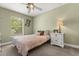 Bedroom featuring natural light, carpet, ceiling fan and neutral paint at 645 Macglenross Dr, Oviedo, FL 32765