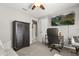 Spacious bedroom featuring neutral walls, plush carpet, and a mounted TV for relaxation and entertainment at 645 Macglenross Dr, Oviedo, FL 32765