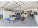 Well-organized garage with ample storage, seating area, and bike rack, ideal for hobbies and projects at 645 Macglenross Dr, Oviedo, FL 32765