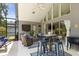 Inviting screened-in lanai with comfortable seating, outdoor dining area, and views of the backyard at 645 Macglenross Dr, Oviedo, FL 32765