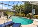 Refreshing pool surrounded by lush landscaping and sun loungers for relaxation and enjoyment at 645 Macglenross Dr, Oviedo, FL 32765
