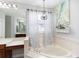 Elegant bathroom with a large soaking tub, vanity area, and decorative wall art at 697 Broadoak Loop, Sanford, FL 32771
