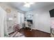 Bright bedroom with a built-in desk, closet, and dark wood floors provides a functional workspace and play area at 697 Broadoak Loop, Sanford, FL 32771