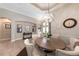 Formal dining room with neutral tones, a large table, and decorative accents for elegant entertaining at 697 Broadoak Loop, Sanford, FL 32771