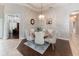 Cozy dining area with a round table, six chairs, and a charming light fixture adjacent to an office at 697 Broadoak Loop, Sanford, FL 32771