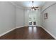 Spacious living room with hardwood floors, large windows, and a ceiling fan for comfortable living at 697 Broadoak Loop, Sanford, FL 32771