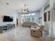 Comfortable living room featuring a plush sectional sofa and a view of the outdoors at 697 Broadoak Loop, Sanford, FL 32771