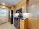 Modern kitchen with stainless steel appliances and wooden cabinets, great for cooking and entertaining at 706 Lynn Ave, New Smyrna Beach, FL 32168
