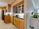 Bright and open kitchen with wooden cabinets and modern appliances, offering a seamless cooking experience at 706 Lynn Ave, New Smyrna Beach, FL 32168