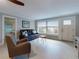 Cozy living room featuring stylish furniture and bright light from the windows and door at 706 Lynn Ave, New Smyrna Beach, FL 32168
