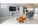 Spacious living room with a fireplace, stylish furniture and bright white trim at 706 Lynn Ave, New Smyrna Beach, FL 32168
