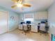 Dual-desk office featuring built-in cabinetry and a view through the window, creating an organized and inviting workspace at 706 Lynn Ave, New Smyrna Beach, FL 32168