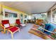 Inviting porch with comfortable seating, a colorful rug, and stylish decor creating a welcoming atmosphere at 706 Lynn Ave, New Smyrna Beach, FL 32168