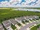Aerial view of homes in a community near a lake at 7367 Catania Loop, Clermont, FL 34714