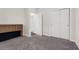 Bedroom with built-in desk and storage, neutral carpet and walls at 7367 Catania Loop, Clermont, FL 34714