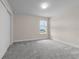 Bright bedroom with large window that allows a clear view of the neighborhood at 7367 Catania Loop, Clermont, FL 34714