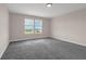 Bedroom featuring plush carpeting, a window with peaceful views at 7367 Catania Loop, Clermont, FL 34714