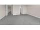 Carpeted floor bonus room with doorways to other parts of the house at 7367 Catania Loop, Clermont, FL 34714