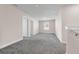 Carpeted bonus room with neutral walls, multiple doors and a window at 7367 Catania Loop, Clermont, FL 34714
