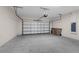 Spacious garage with a garage door and plenty of room for vehicles and storage at 7367 Catania Loop, Clermont, FL 34714