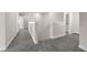Hallway with carpeted floors and banister at 7367 Catania Loop, Clermont, FL 34714