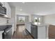 Well-equipped kitchen with stainless steel appliances and white cabinets at 7367 Catania Loop, Clermont, FL 34714