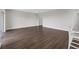 Spacious living room with modern wood flooring and ample natural light at 7367 Catania Loop, Clermont, FL 34714