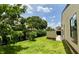 Spacious backyard featuring lush green grass and a privacy fence at 761 Golden Sunshine Cir, Orlando, FL 32807