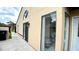 Beige home featuring large window and sliding door to the outside area at 761 Golden Sunshine Cir, Orlando, FL 32807
